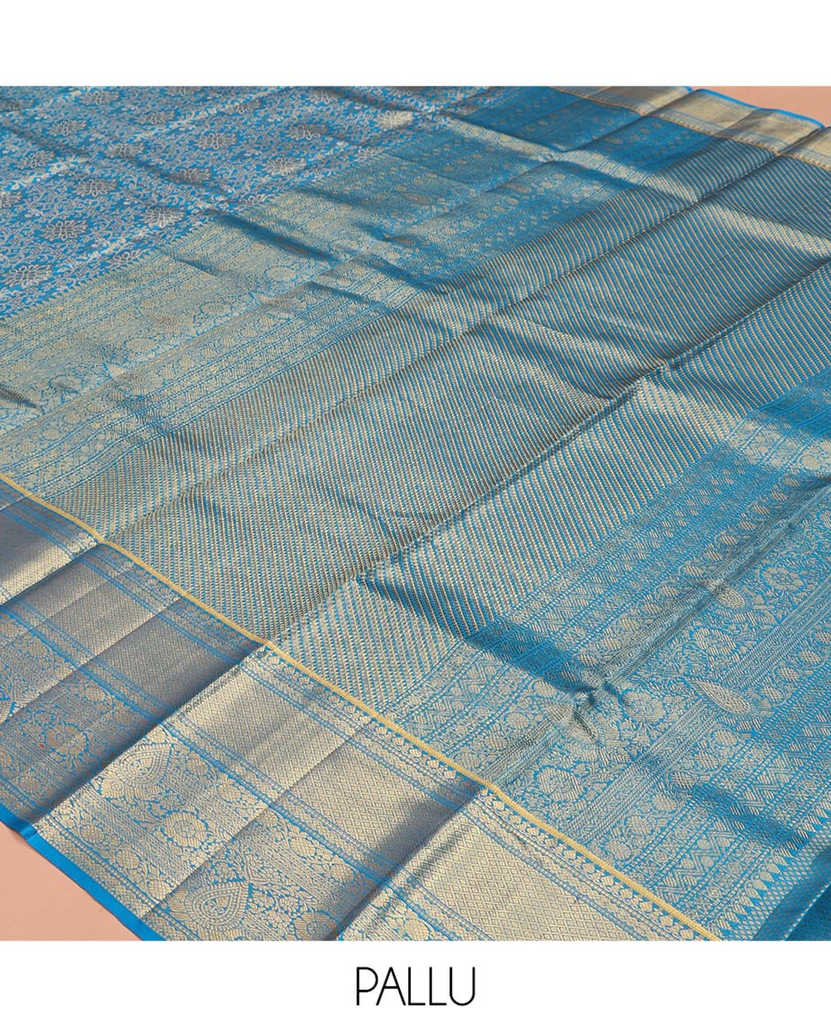 Blue Kanchipuram Tissue Silk Saree, Elegantly Framed with Jacquard Designs on Its Body, Highlighted by a Zari Border of Traditional Designs, Intricately Designed Pallu, and Paired with a Matching Blouse