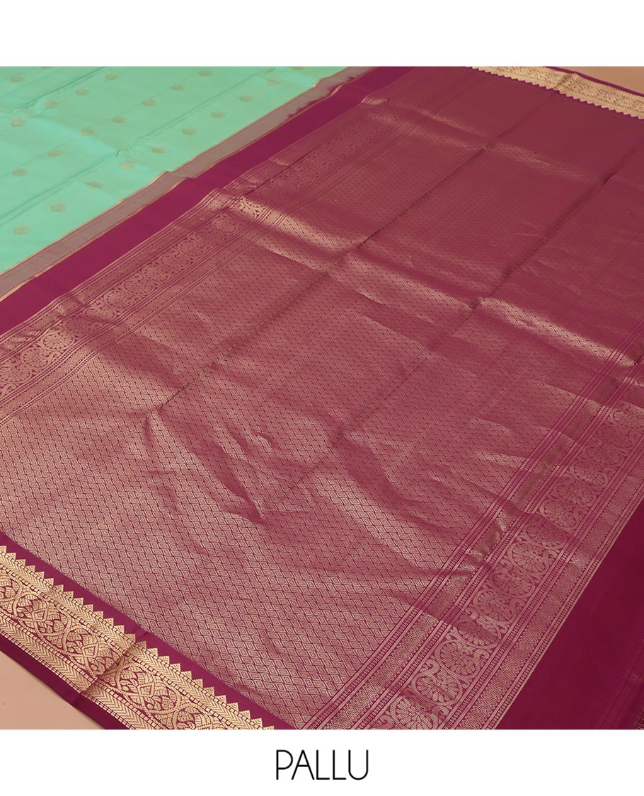 Light Turquoise Vasundhara Silk Saree, Sparsely Woven with Zari Buttas All Over Its Body, Complemented by a Contrast Border of Rekku, Muthu, Kathir, and Kodi Visiry Designs, Grand Jaal Pallu, and Paired with a Contrast Blouse