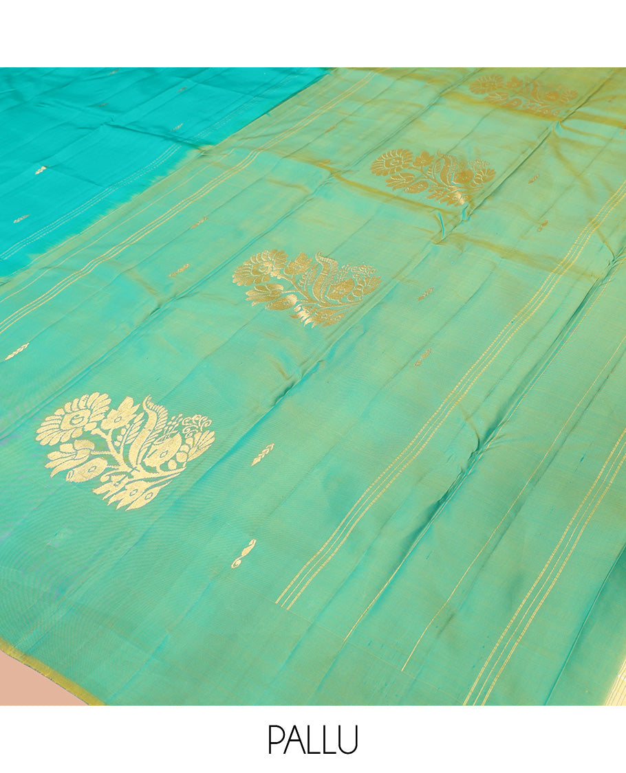 Blue Kanchipuram Silk Saree, Graced with Zari Buttas, Contrast Mayil Border, Floral Design Woven Pallu, and a Contrast Blouse