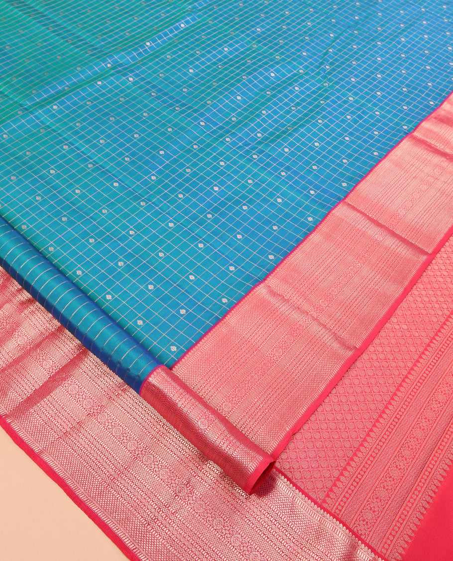 Blue Vasundhara Silk Saree, Featuring Zari Butta Enclosed Checks, a Contrast Border of Thilakam Mokku, Muthu, Mayil Kann, Rettai Neli, and Vanki Designs, Jaal Pallu, and Contrast Blouse