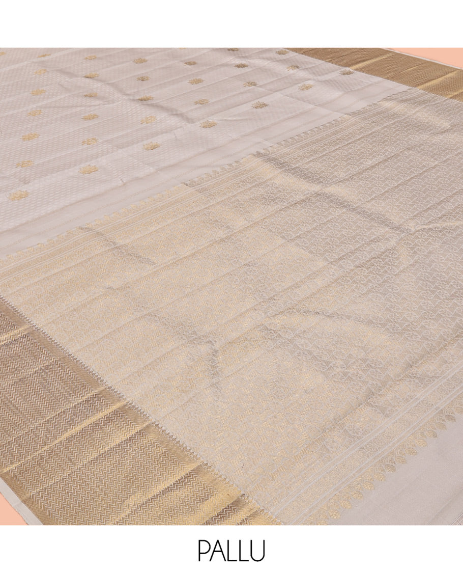 Cream Embossed Parambara Silk Saree, Enthralled with Zari Buttas, a Zari Border of Thilakam Mokku, and Vanki Designs, Grand Pallu, and Matching Blouse
