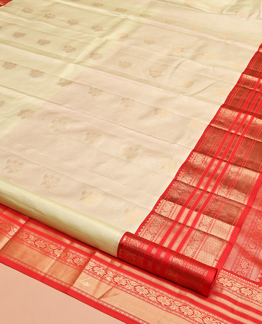 Pale Green Vasundhara Silk Saree,Sparsely Woven with Zari Buttas, Contrast Border of Thilakam Mokku, Kodi Visiry, Muthu, Mayil Kann, Mayil, and Kodi Visiry, Grand Pallu, and Contrast Blouse