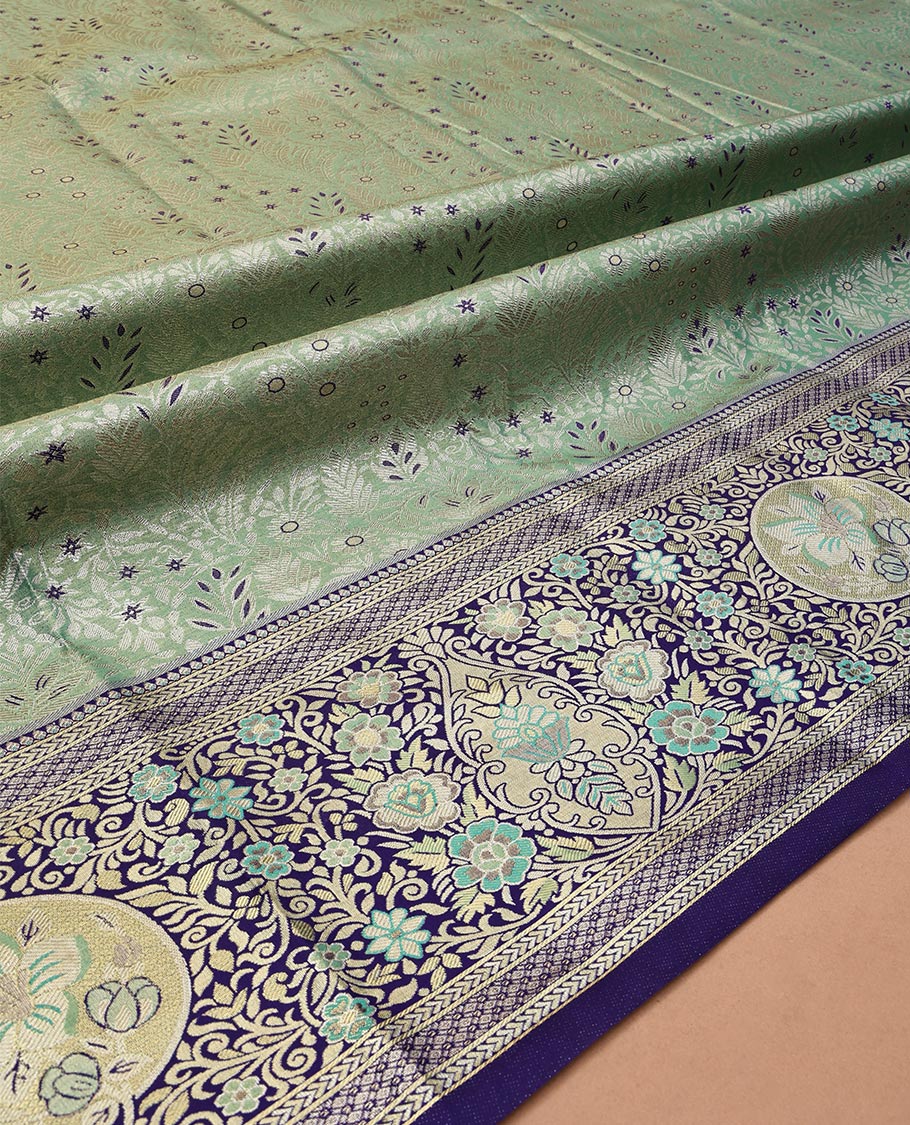 Green Art Silk Half-Saree, Richly Detailed with Jacquard Design, Contrast Intricate Motif Border, Paired with a Contrast Jacquard Blouse, and an Intricate Dhavani