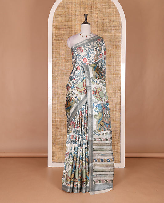 Cream-base multi-color kalamkari floral-vine and peacocks printed semi-tussar saree, gold zari piping border, kalamkari printed pallu, and contrast printed blouse