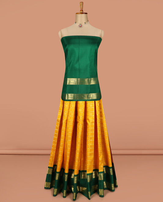 Yellow pure silk half saree, mayil chakram enclosed neli checked skirt, contrast rettai pettu border and blouse of thilakam mokku, muthu, mayil and yaali design and intricate pallu