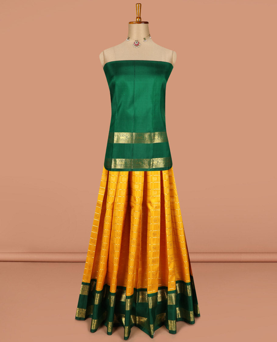 Yellow pure silk half saree, mayil chakram enclosed neli checked skirt, contrast rettai pettu border and blouse of thilakam mokku, muthu, mayil and yaali design and intricate pallu