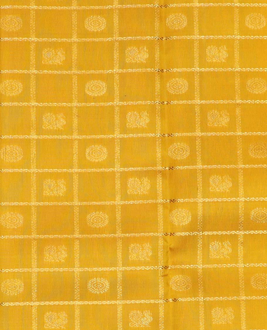 Yellow pure silk half saree, mayil chakram enclosed neli checked skirt, contrast rettai pettu border and blouse of thilakam mokku, muthu, mayil and yaali design and intricate pallu
