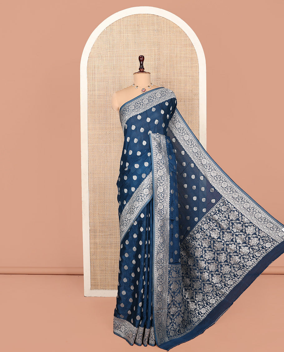 Blue Fancy Crepe Saree, Gleamed Up with Thilakam Buttas, Highlighted by a Traditional Border, Intricately Designed Pallu, and a Matching Blouse