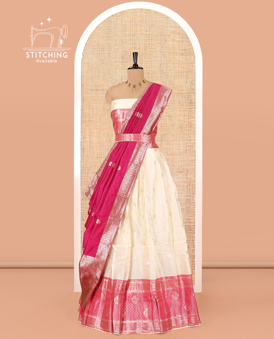 Cream-Rani Pink Semi-Banarasi Half-Saree Set Featuring Buttas Skirt, Contrast Traditional Border, a Matching Blouse, and a Banaras Dhavani