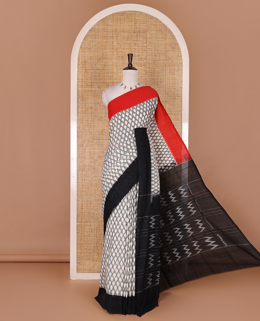 Half white jaal design ikkat cotton saree, contrast plain ganga jamuna border, ikkat jaal pallu, and contrast plain blouse