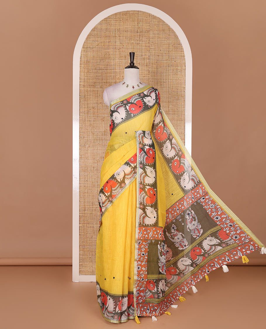 Yellow mirror thread embroidered linen saree, contrast kalamkari peacock printed border, pallu of kalamkari peacock and human figurines print, and printed blouse