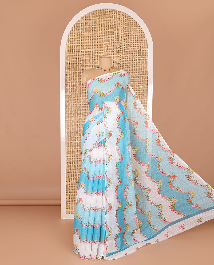 Borderless blue rangkat style dyed and floral printed linen cotton saree with a contrast printed blouse