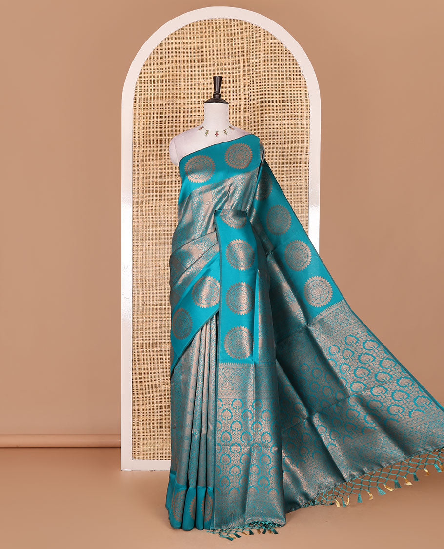 Rama green jacquard kanchi tissue saree, zari chakram motifs border, intricately zari woven pallu, and a matching zari design blouse