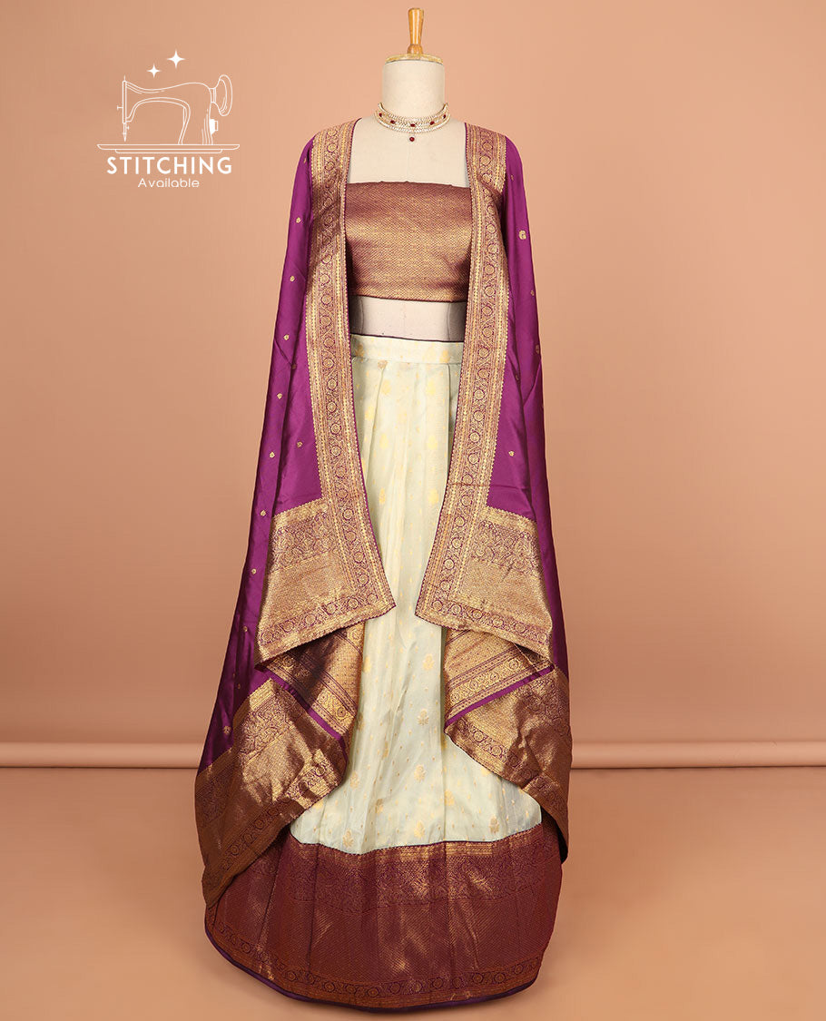 Cream buttas half saree with contrast zari design border, zari design blouse & purple floral vine zari design dhavani