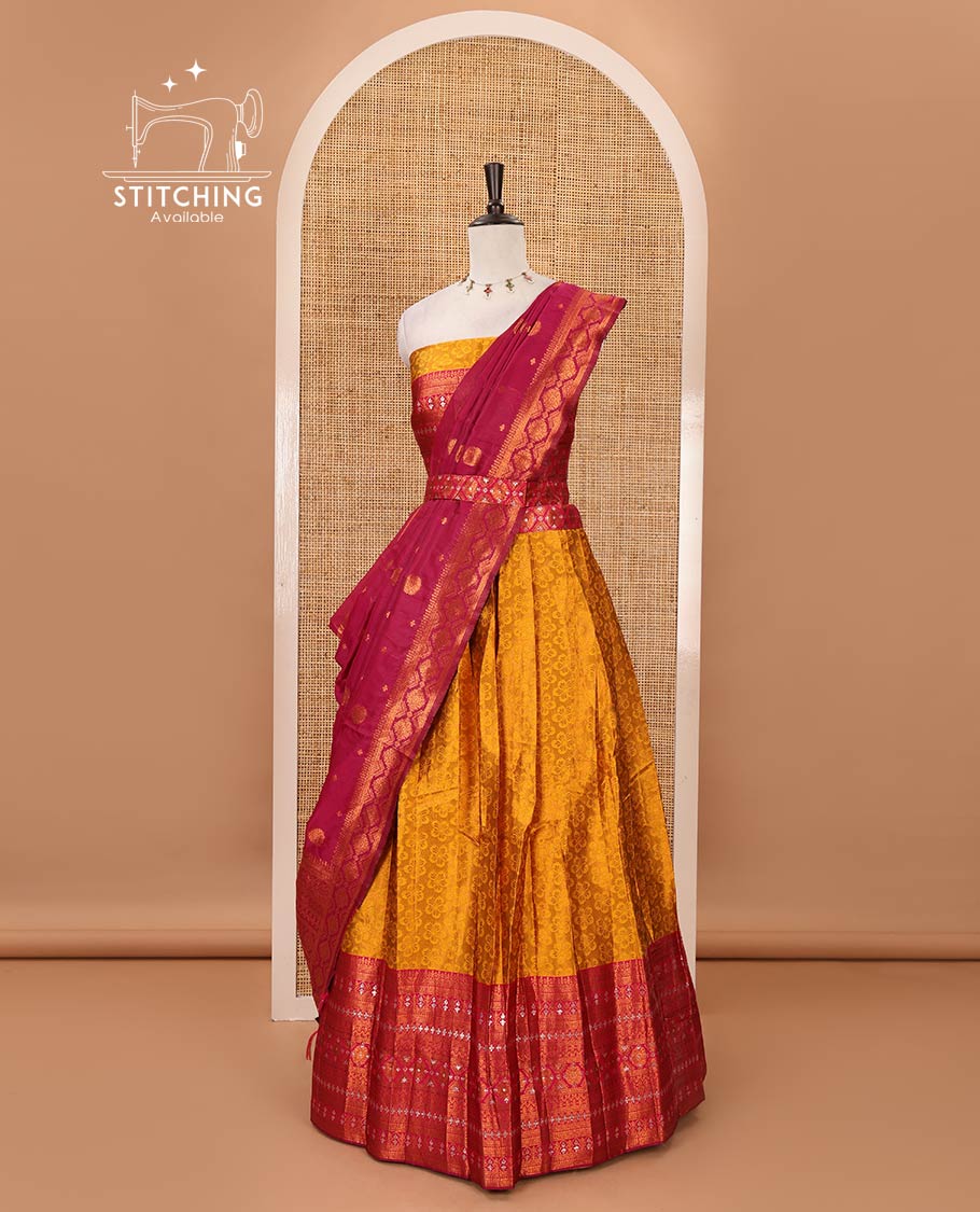 Mustard semi-banaras half-saree, embossed & contrast traditional zari border skirt,blouse of embossed & zari work & contrast-rani pink zari design dhavani