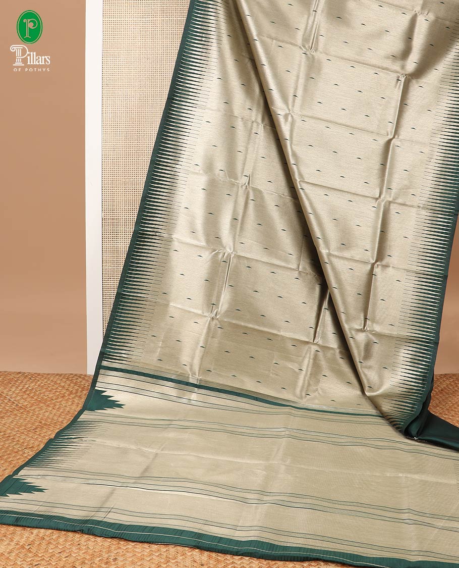Gold with green color gold zari brocade, thread butta design banaras tissue saree with contrast temple border & lining chit pallu along with plain blouse