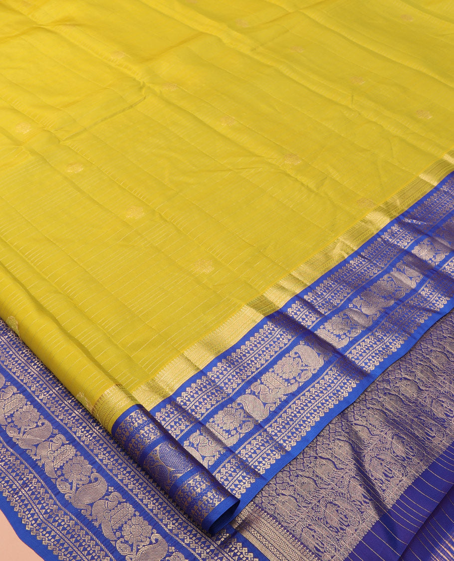 Green Vasundhara Lite Silk Mix Saree, Beautified with Zari Buttas and Checks, a Contrast Border of Kathir, Neli, Rekku, Thilakam Mokku, Manga, and Mayil Designs, Grand Pallu, and a Contrast Blouse