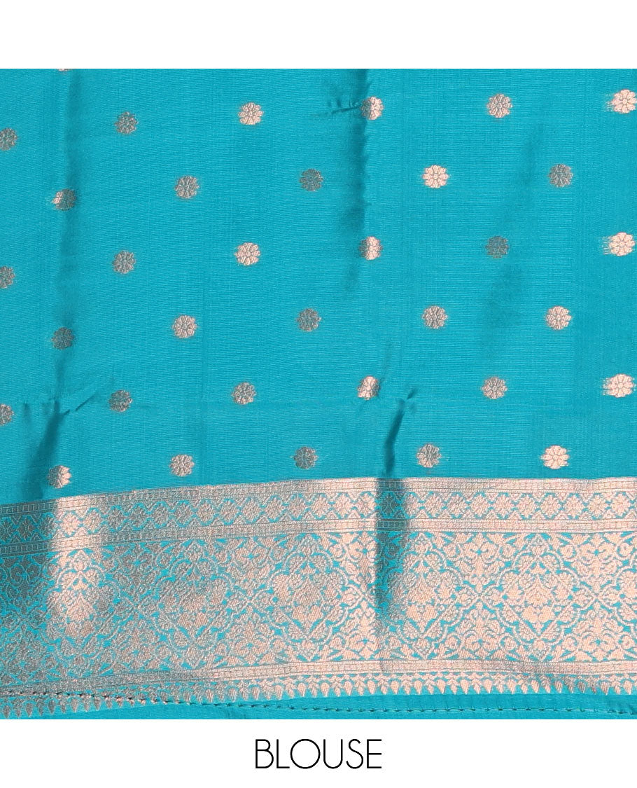 Rama green jacquard kanchi tissue saree, zari chakram motifs border, intricately zari woven pallu, and a matching zari design blouse