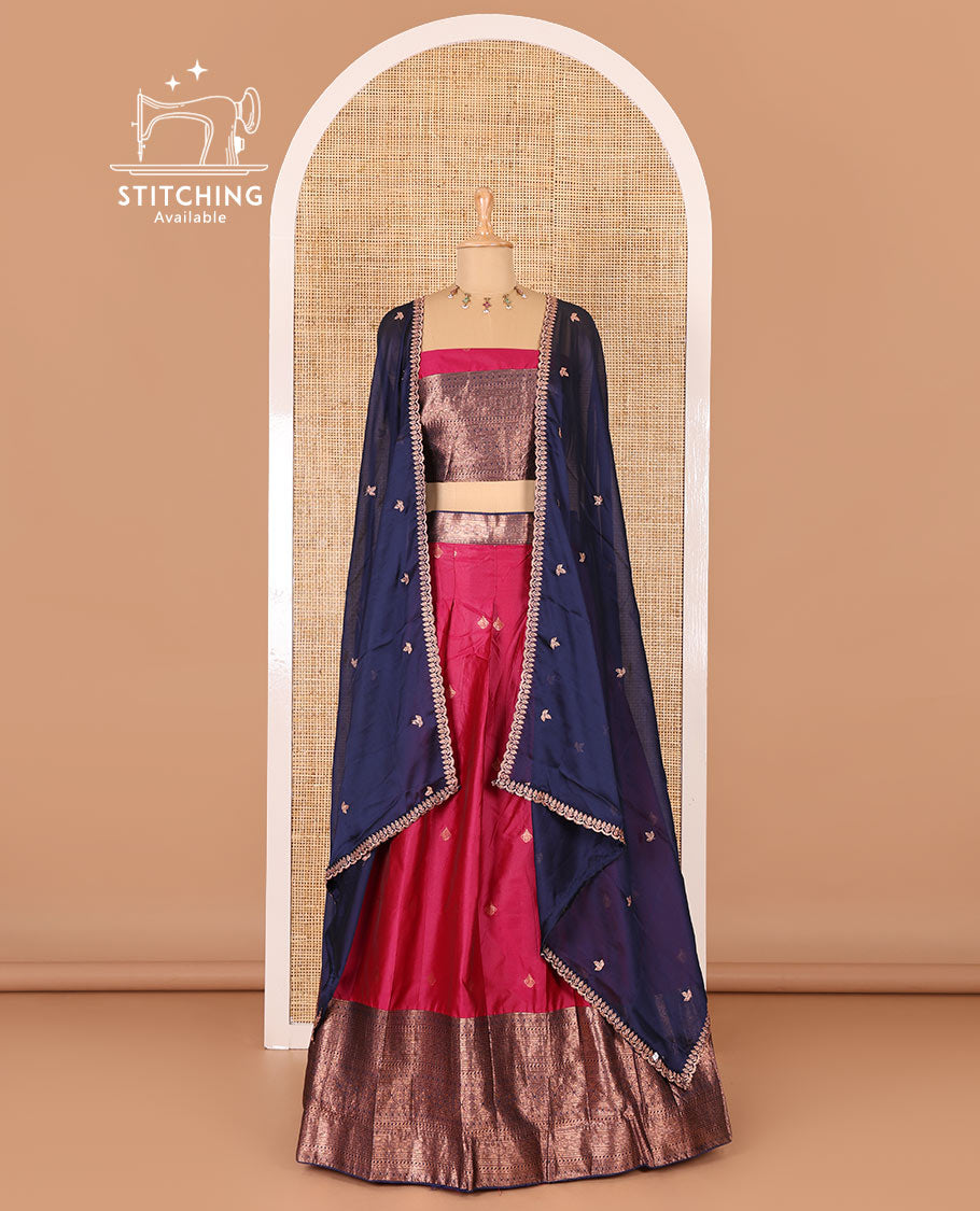 Rani pink taffeta silk half-saree, zari buttas and contrast traditional zari bordered skirt, a matching blouse, and contrast embroidered satin georgette dhavani