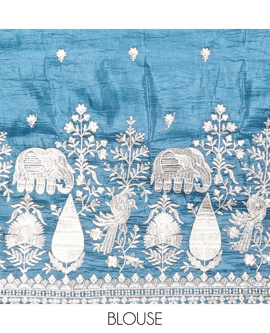 Blue floral, elephant embroidered half saree with self embroidered border, floral embroidery blouse & floral buttas , scallop border dhavani