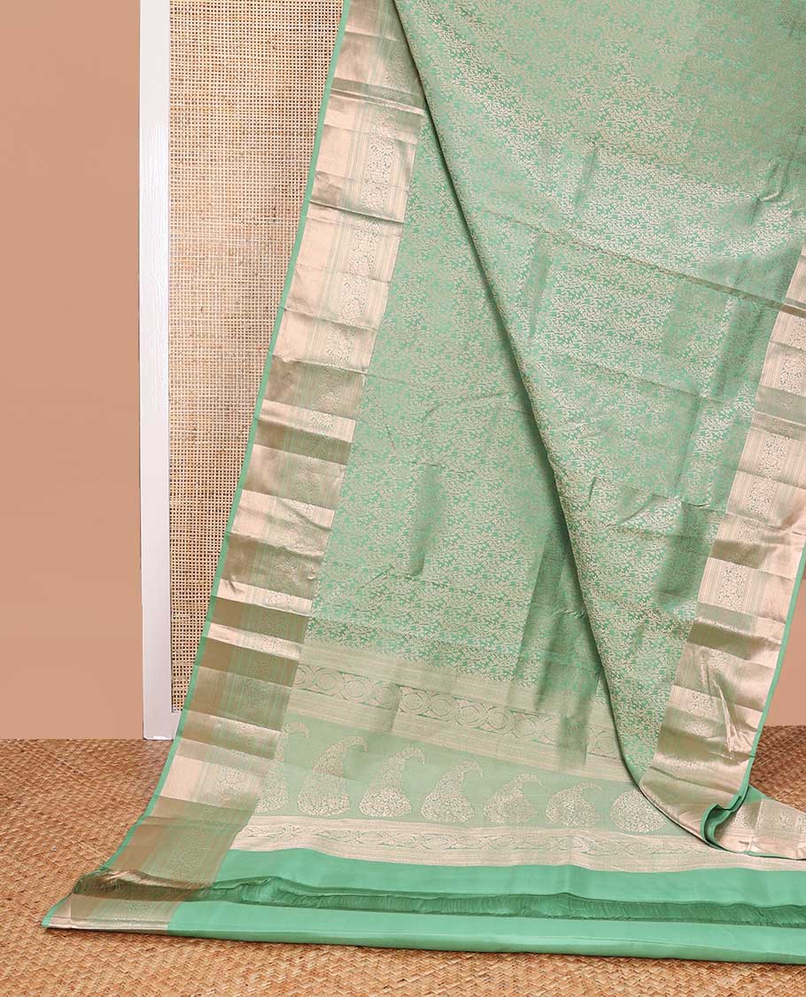 Green floral design kancheepuram silk saree with self border of intricate zari design border & floral design pallu