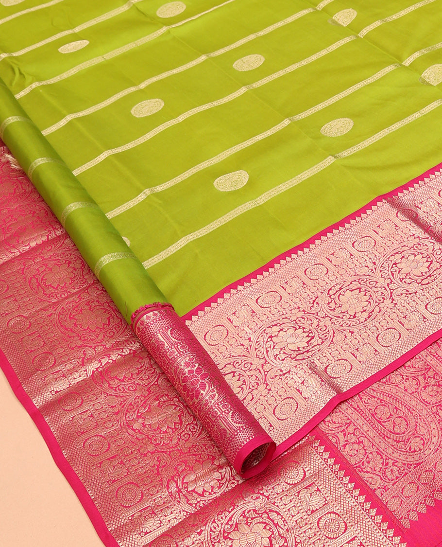 Parrot Green Vasundhara Silk Saree Featuring Veldhari and Round Kuthirai Motifs, Complemented by a Contrast Border of Thilakam Mokku, Muthu, Annam Chakram, and Kodi Visiry Designs, Pallu Elevated with Floral Designs, and Paired with a Contrast Blouse