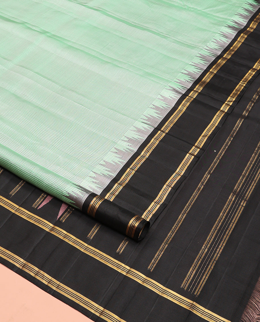 Green micro-checked Kanchipuram silk saree, contrast thazampoo rekku border, and zari striped pallu
