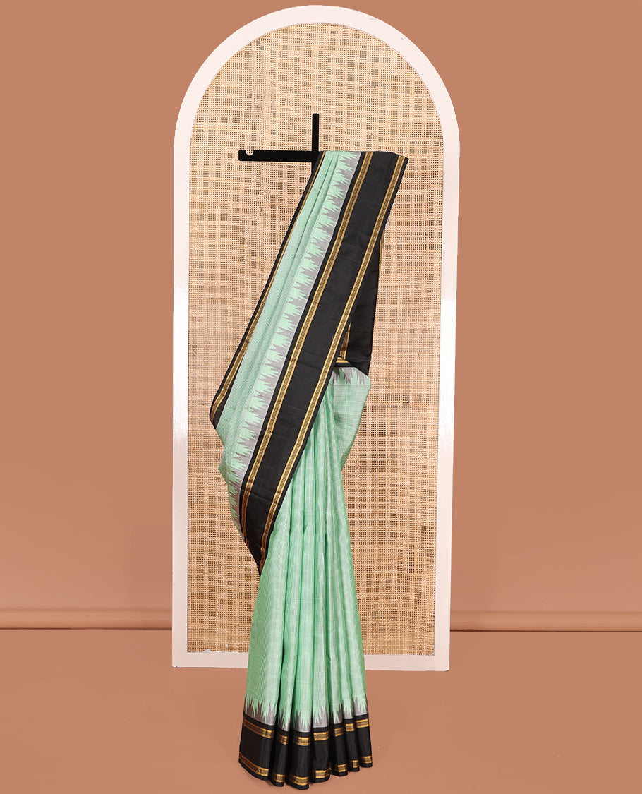 Green micro-checked Kanchipuram silk saree, contrast thazampoo rekku border, and zari striped pallu