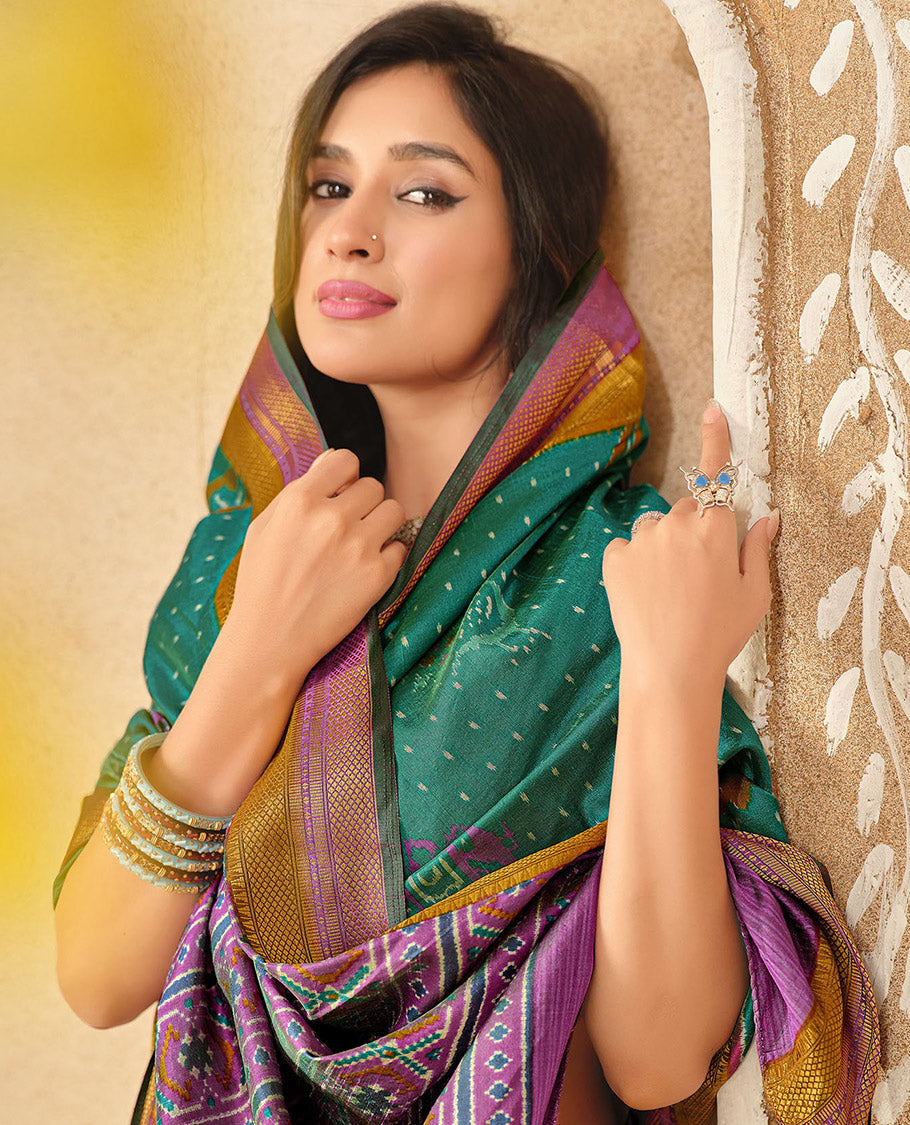 Green Fancy Raw Silk Designer Saree, Embellished with Ikat Butta and Bird Buttas, a Contrast Traditional Border, a Patola-Printed Pallu, and a Contrast Blouse