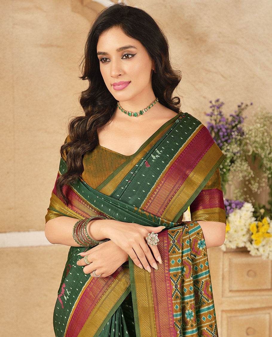 Green Fancy Raw Silk Designer Saree, Decked Up with Ikat Butta and Bird Buttas, a Contrast Traditional Border, a Patola-Printed Pallu, and a Contrast Blouse