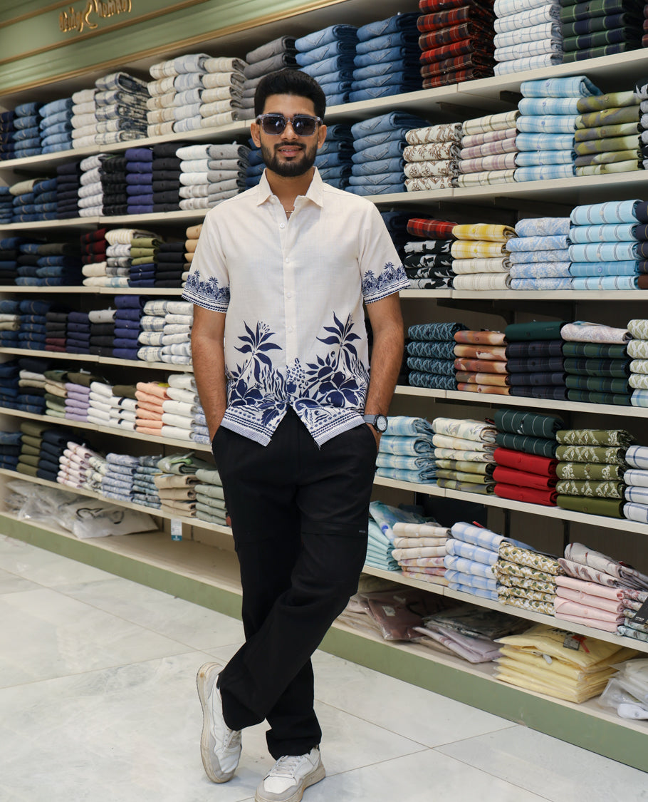 Cream Cotton-Blended Casual Shirt Features Tropical Floral Print, Half-Sleeves, a Spread Collar, Regular Fit and Regular Length