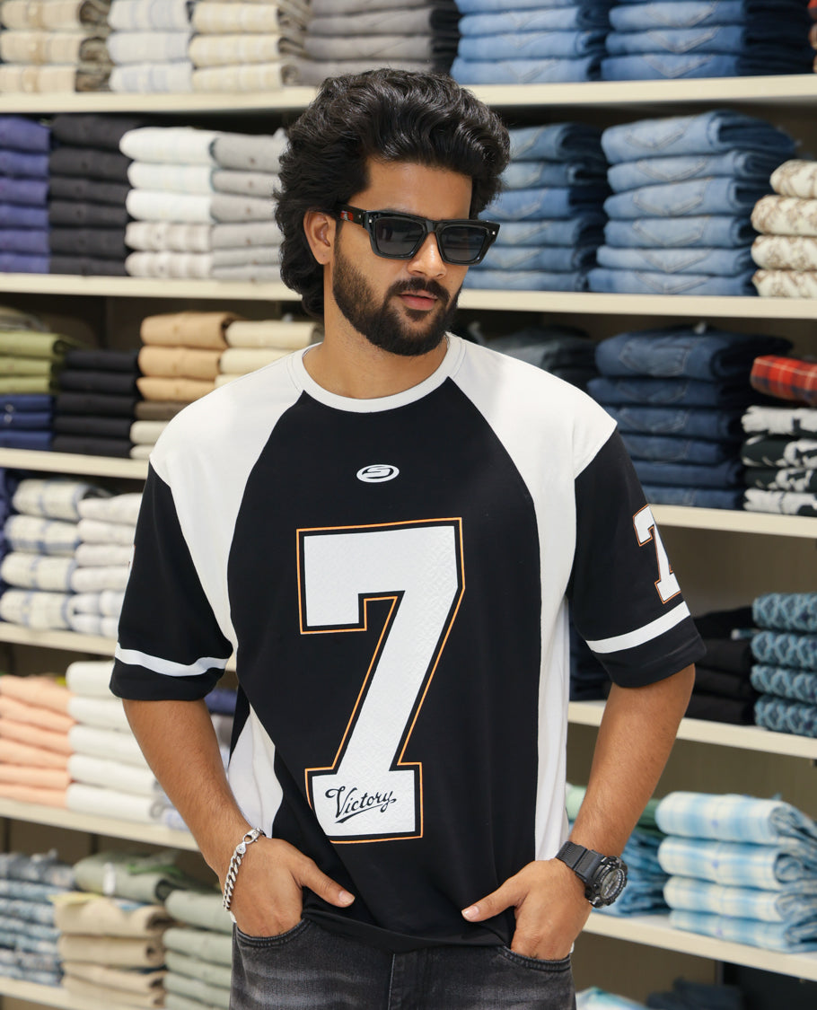 Black Cotton-Blended Oversized Printed Jersey-Style T-shirt Comes with Half-Sleeves, Round Neck, and Regular Length