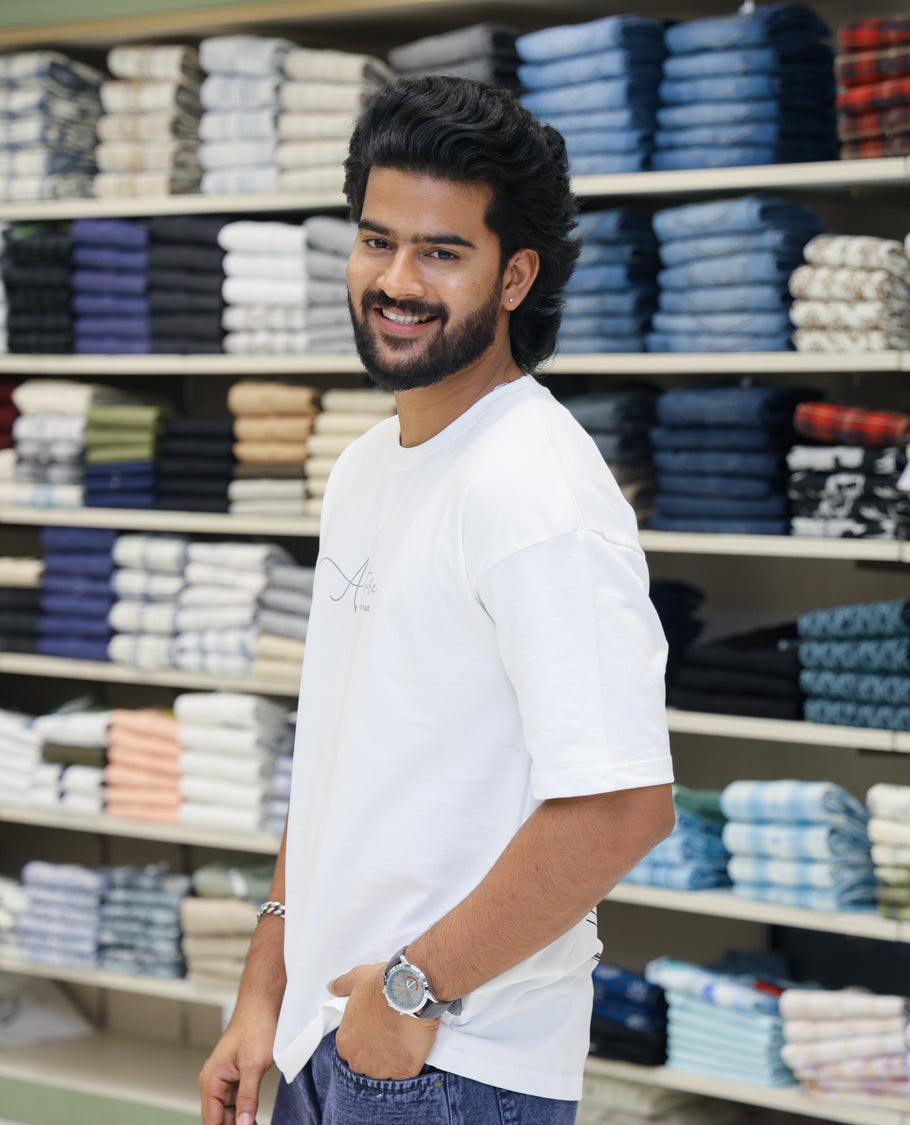 White Cotton-Blended T-shirt Features Funky and Bold Motifs Print, Half-Sleeves, Oversized Fit, Round Neck, and Regular Length