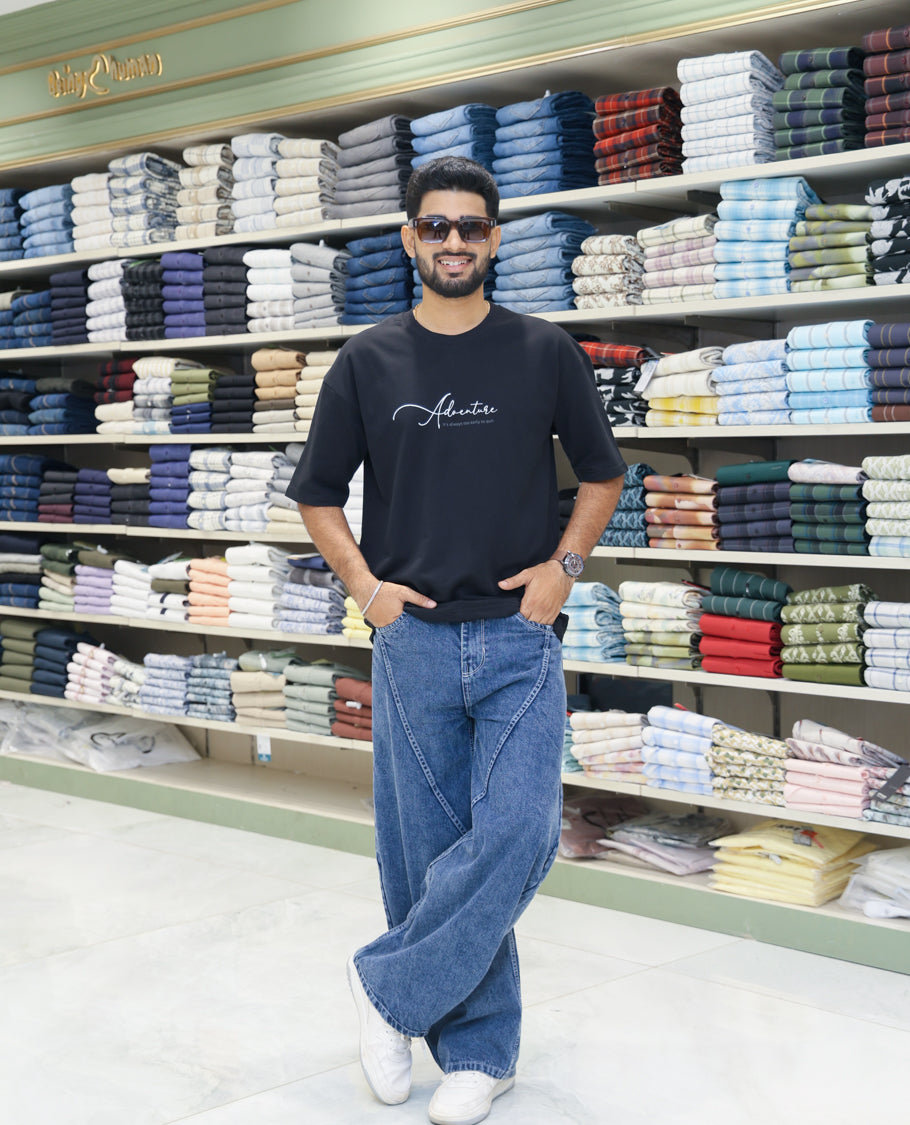 Black Cotton-Blended T-shirt Features Funky and Bold Motifs Print, Half-Sleeves, Oversized Fit, Round Neck, and Regular Length