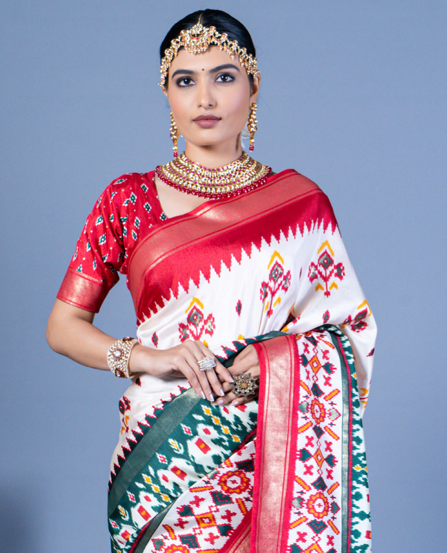 White patola floral motifs designer saree, contrast temple border, and patola printed pallu
