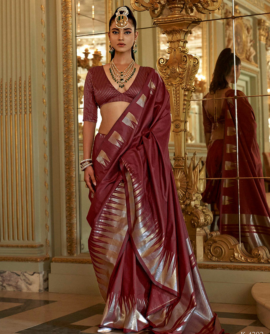 Maroon Plain Designer Saree, Complemented by a Gleaming Temple Zari Border, Scintillating Zari Decked Up Pallu, and Comes with a Matching Blouse