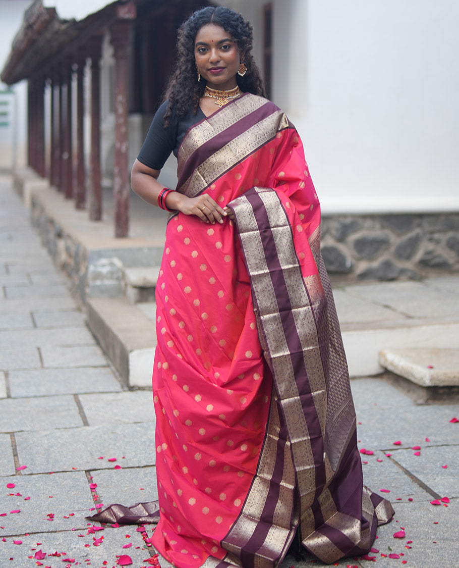 Orange and Brown Budget Silk Saree, Adorned with Zari Buttas All Over Its Body, Complemented by Contrast Rettai Pettu Traditional Zari Border of Jada Nagam, Pallu Steeped with Paisleys, and Paired with a Contrast Blouse