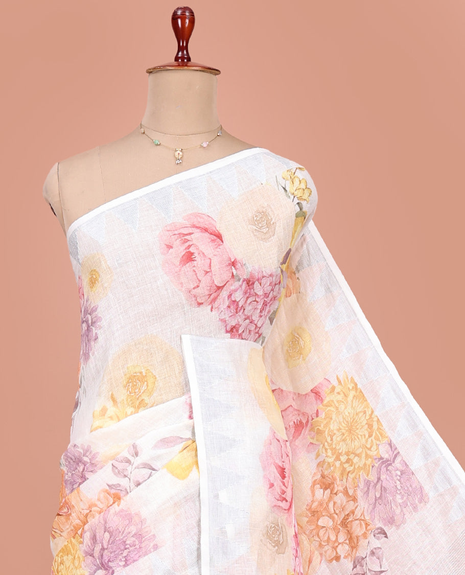 Cream-Base Linen Saree, Adorned with Floral-Themed Paint Splashes Printed All Over Its Body, Sparsely Woven Temple Border, and Paired with a Matching Blouse