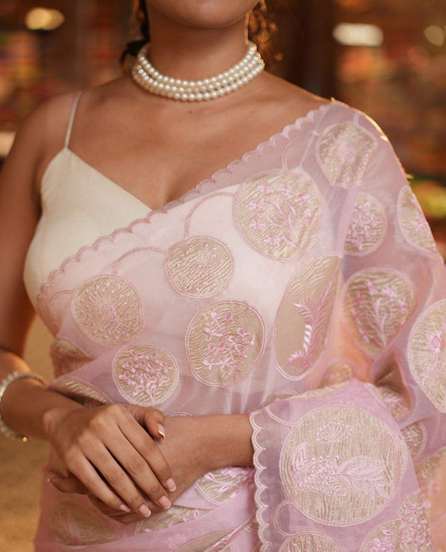 Pearl Pink Organza Saree, Delicately Threaded with Floral Enclosed Circle Motifs Embroidery, Subtle Scallop Border, Delicately Embroidered Pallu, and Paired with a Matching Embroidered Blouse