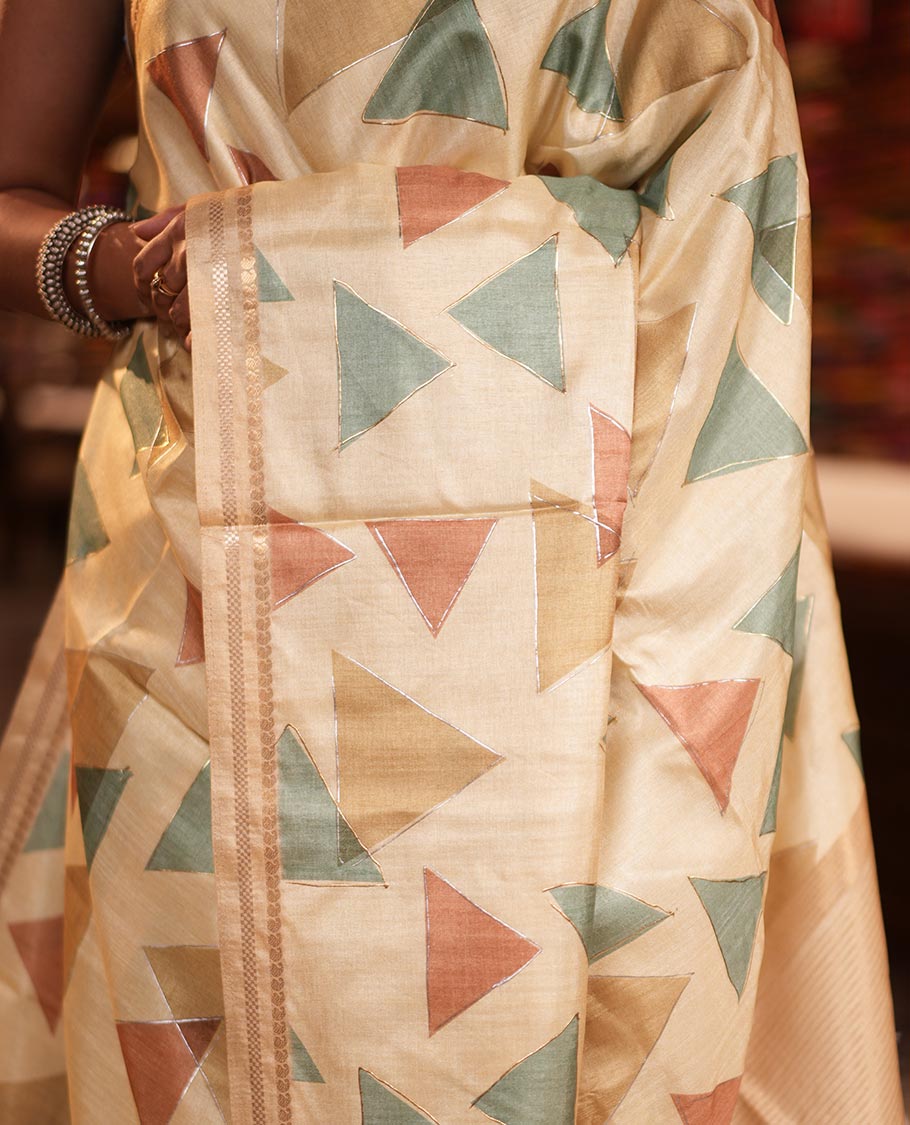 Light Yellow Fancy Tussar Silk Saree Features Triangle Motifs, Zari Border, Striped Pallu, Matching Blouse