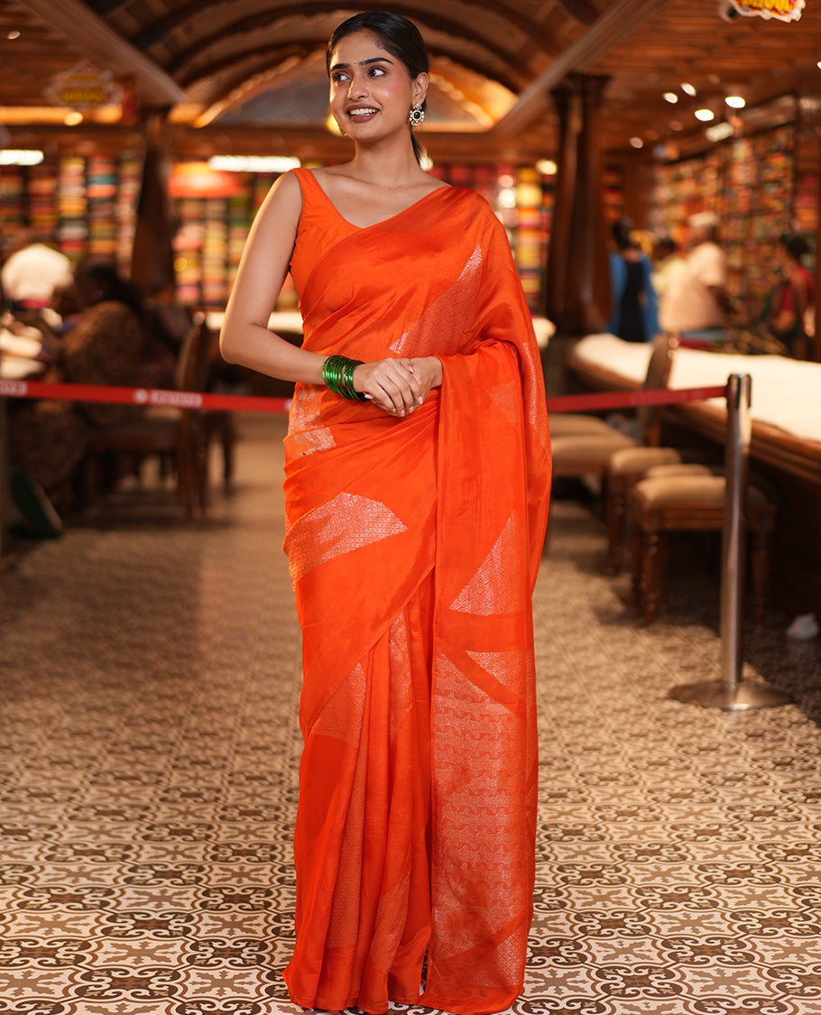 Borderless Orange Chanderi Cotton Saree, Richly Detailed with Zari Triangle Motifs Steeped All Over Its Body, Highlighted by Grand Zari Rich Pallu, and Paired with a Matching Brocade Blouse