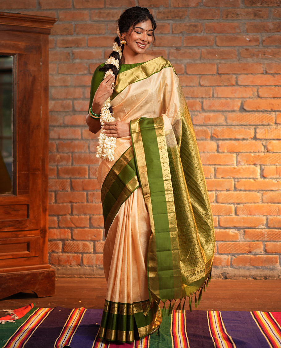 Sandal Vasundhara Silk Saree, Finely Crafted with Zari Buttas and Checked Design, Complemented by a Contrast One-Sided Rettai Pettu Border of Rekku, Laddu Kamalam, Mayil Kann and Kodi Visiry Designs, Grand Jaal Pallu, and Paired with a Contrast Blouse