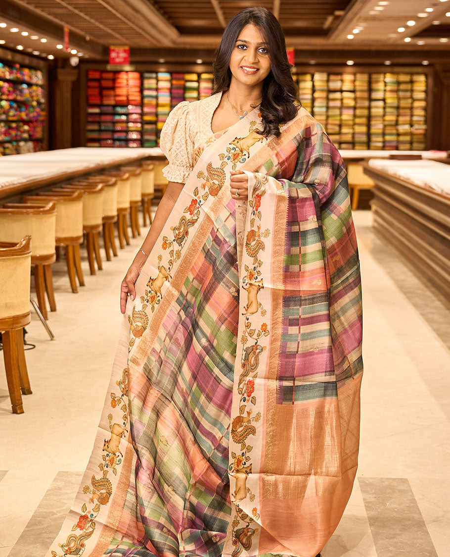 Multi-color checked & buttas tussar silk saree, contrast printed border of kalamkari peacock, floral & Pichwai cow & zari-rich pallu