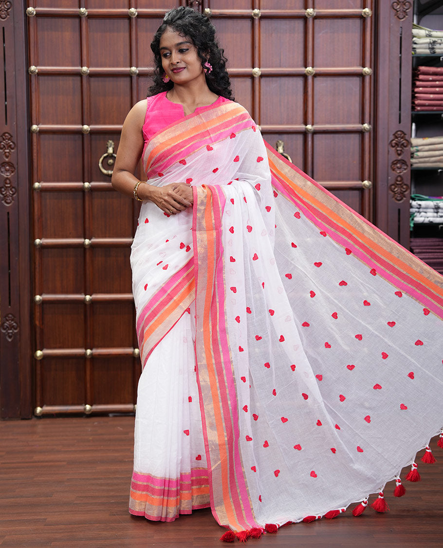White Khadi Mul Cotton Saree, Artfully Designed Heart Motifs Embroidered on Its Body, Complemented by a Contrast Multi-Colored Striped Border, Pallu Steeped with Heart Motifs Embroidery, and Paired with a Matching Blouse