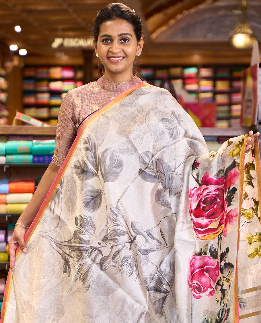 Half-white colorful floral printed banana pith saree, contrast piping border, and floral motifs printed pallu
