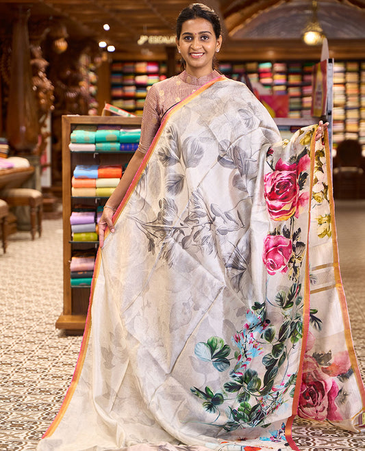 Half-white colorful floral printed banana pith saree, contrast piping border, and floral motifs printed pallu