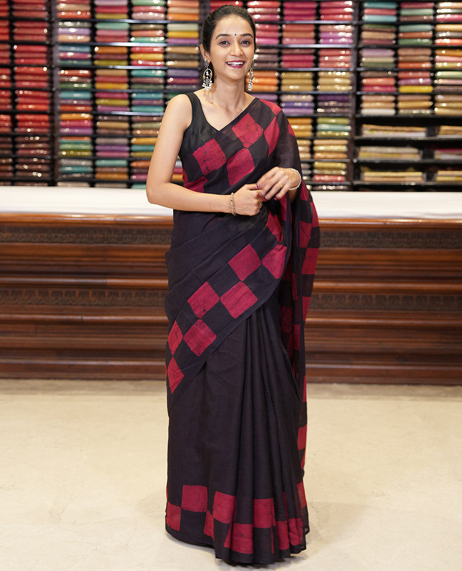 Black kota cotton saree with box type pathik printed border & printed pallu along with printed blouse