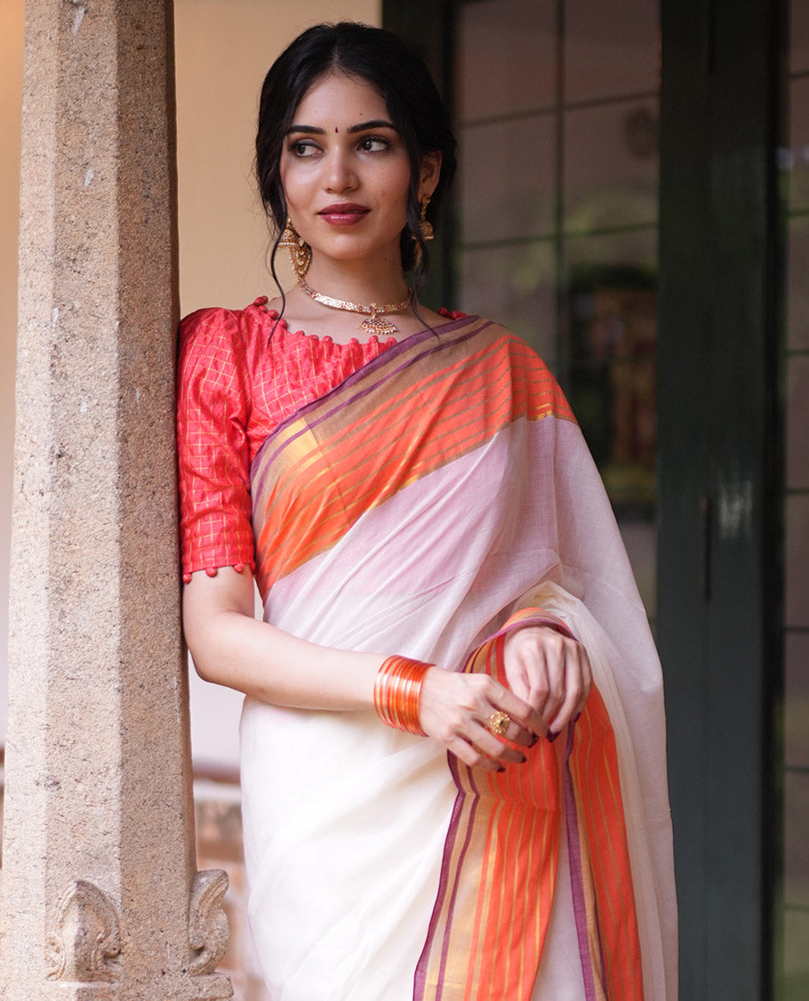 Cream Plain Khadi Mul Cotton Saree, Complemented by a Contrast Orange Border of Zari Stripes, a Self-Pallu, and Has No Blouse