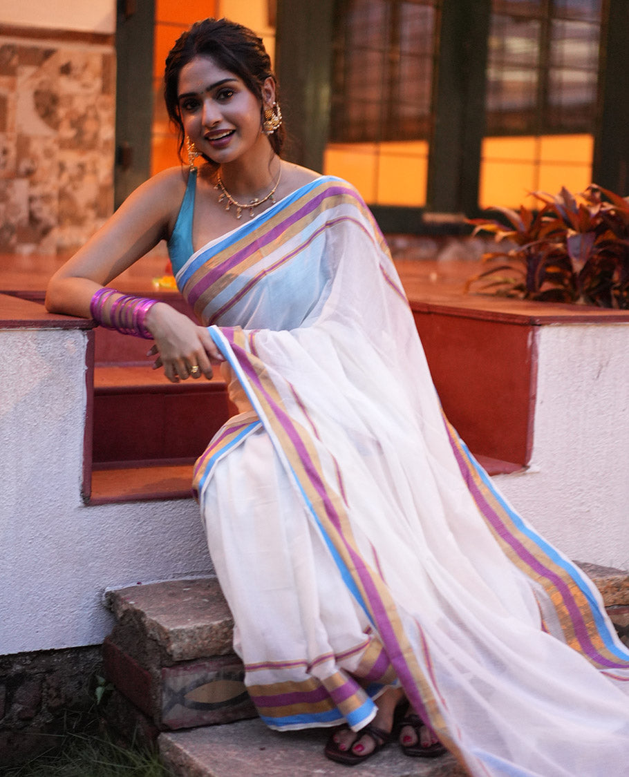 Cream Khadi Mul Cotton Saree, Complemented by a Contrast Multi-Colored Zari Striped Border, and a Matching Blouse