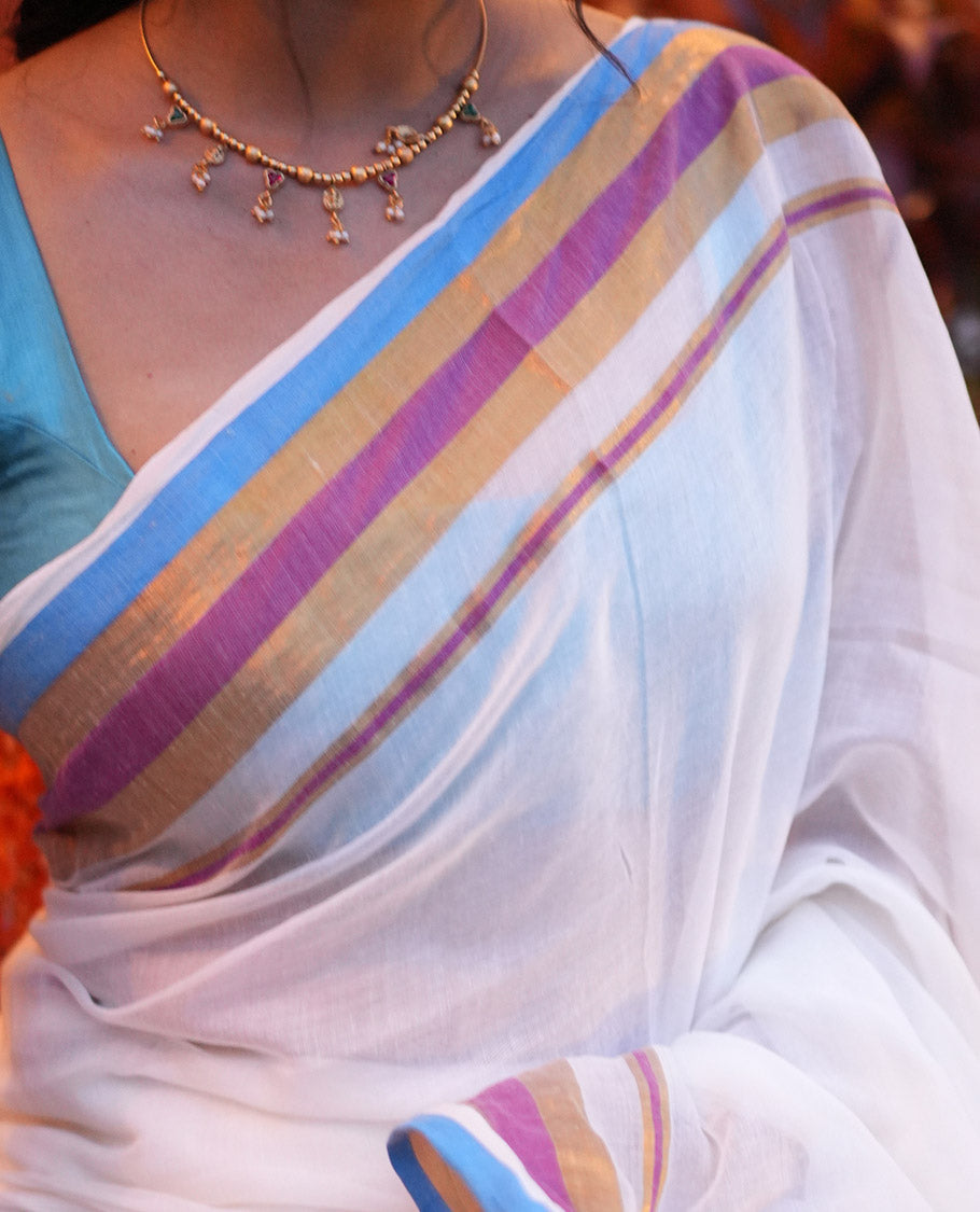 Cream Khadi Mul Cotton Saree, Complemented by a Contrast Multi-Colored Zari Striped Border, and a Matching Blouse